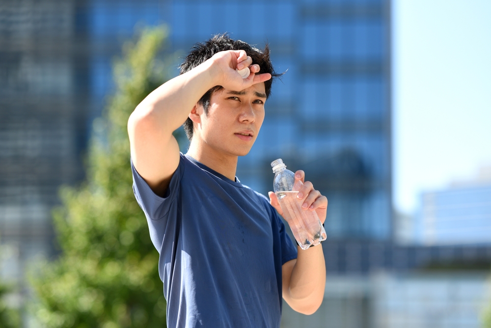 Japanese runner with drink